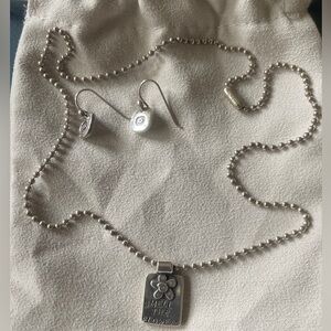 Sterling silver necklace and earring set.